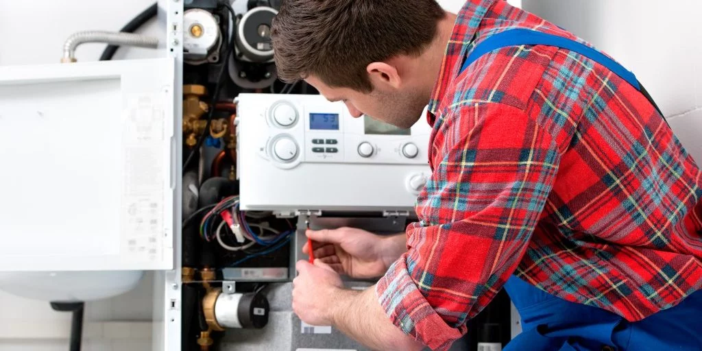 An engineer is installed a boiler