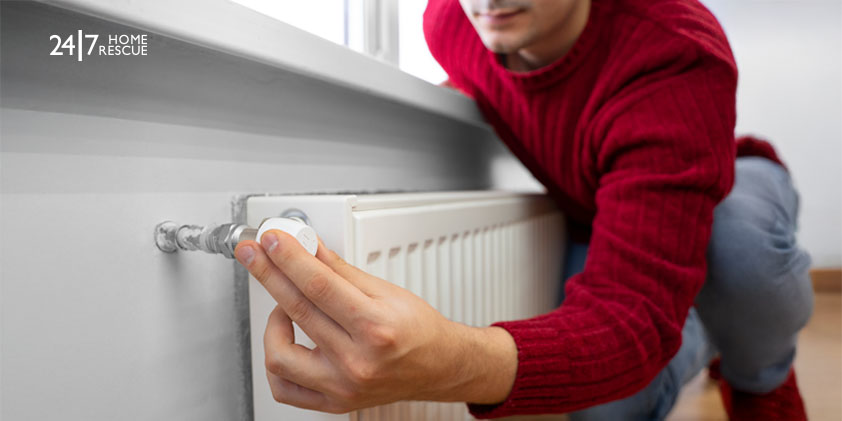 Man adjusting Radiator