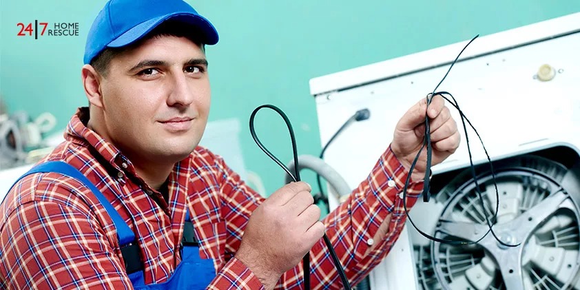 A Mechanic Repairer Replaces a Rubber Drive Belt