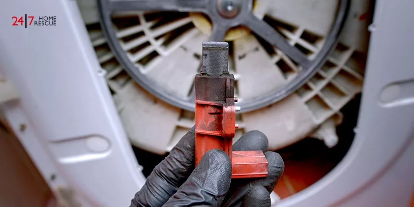 Man Replacing Carbon Motor Brushes on Wash Machine