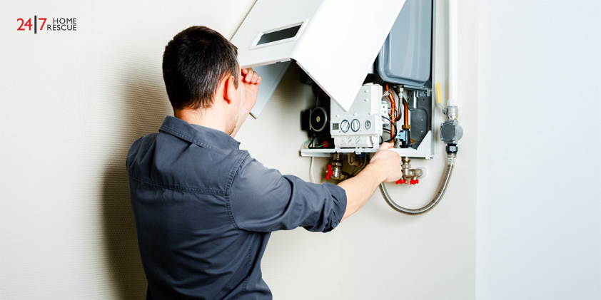 Engineer repairing boiler system at home