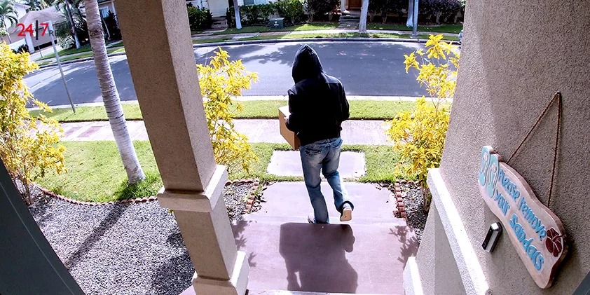 A package thief was caught on camera stealing a box delivery from the door