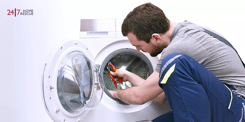 Side View of a Repairman Checking the Washing Machine at Home