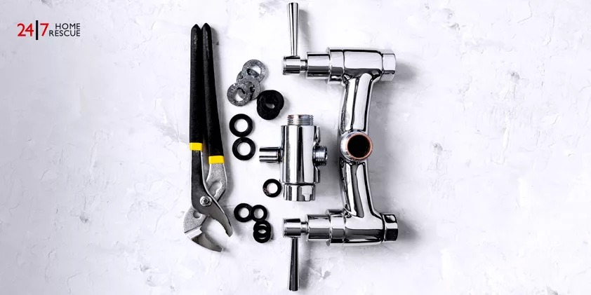 top view of a wrench, disassembled Diverter valve, diverter, spout, and gaskets