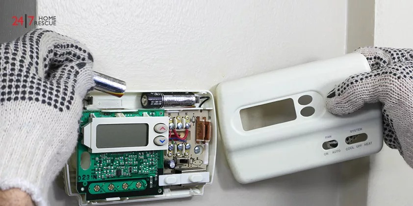 Installing Batteries in a Digital Heating and Cooling thermostat