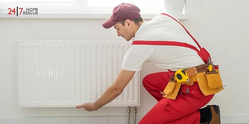 An engineer is placing a radiator