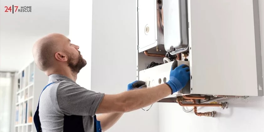 An engineer is repairing a boiler