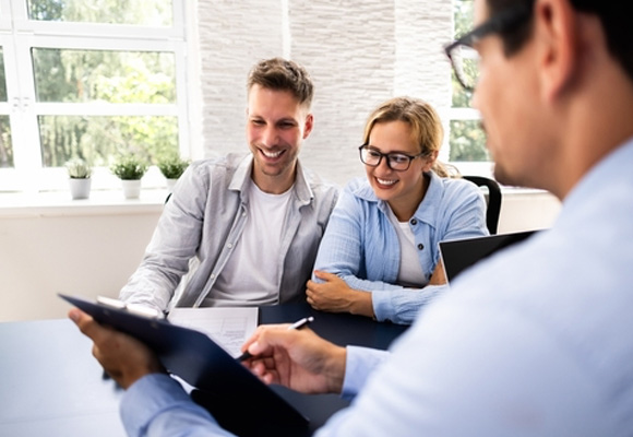 A financial consultant explained the new boiler investment to a young couple