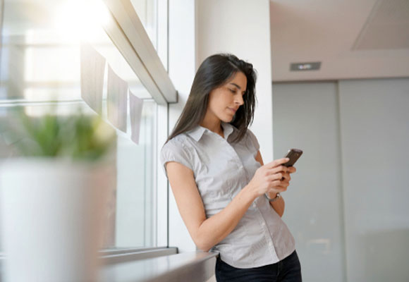 A woman is searching on her phone