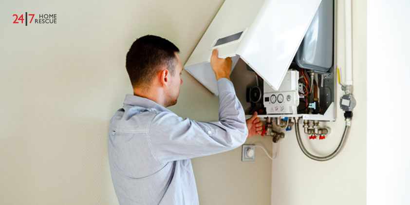 A person is checking a boiler