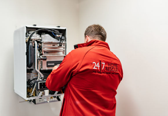 A 24|7 home rescue engineer is installing a new boiler