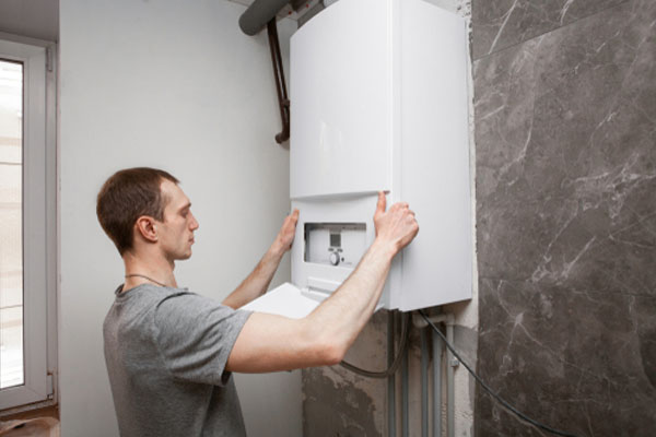 Homeowner is checking a boiler