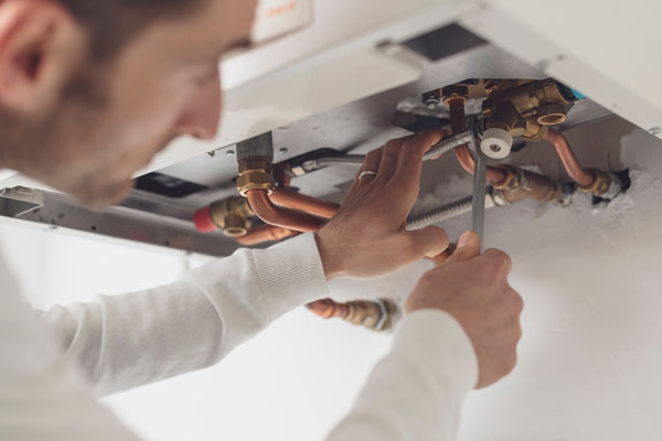 An engineer is starting a boiler service process