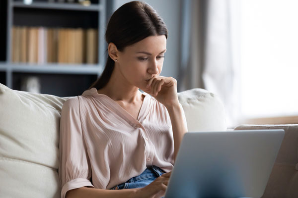 Customer is thinking in the laptop