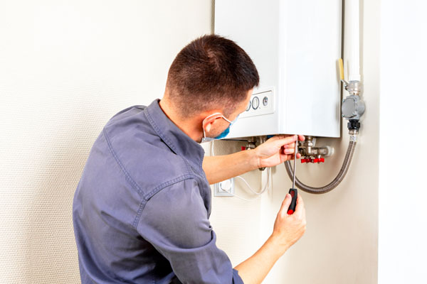 Engineer servicing the boiler