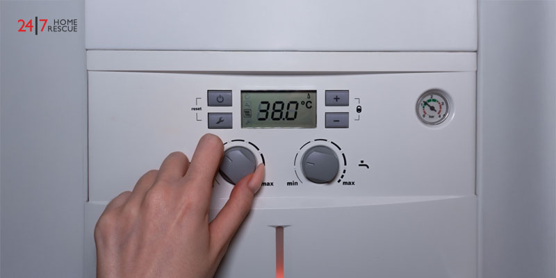 adjusting the pressure gauge on a boiler