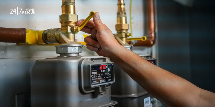 person adjusting a gas meter