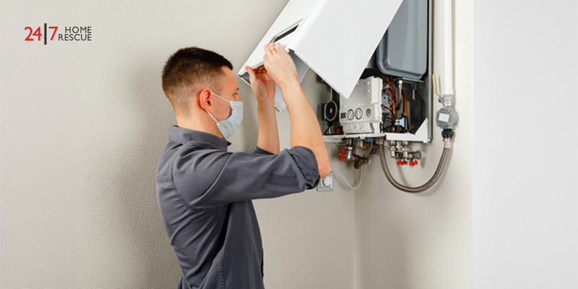 Heating engineer replacing worn ignition electrode in Worcester gas boiler to fix ignition fault
