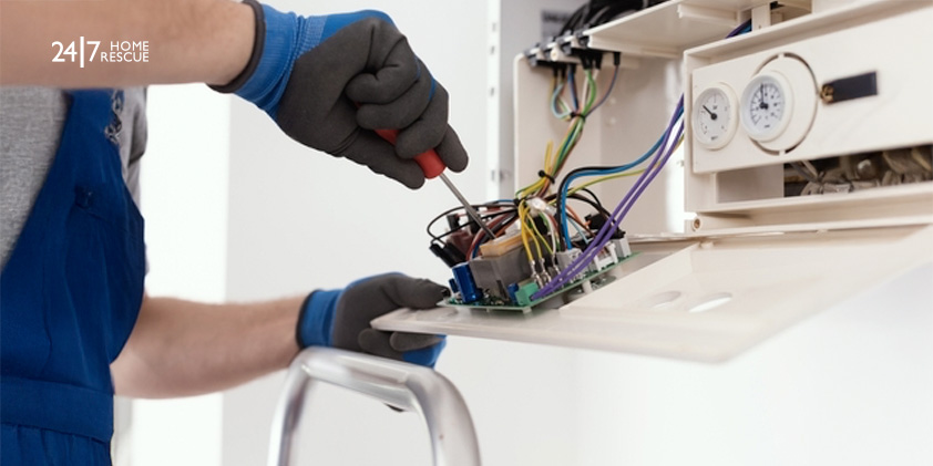 Engineer fixing boiler PCB