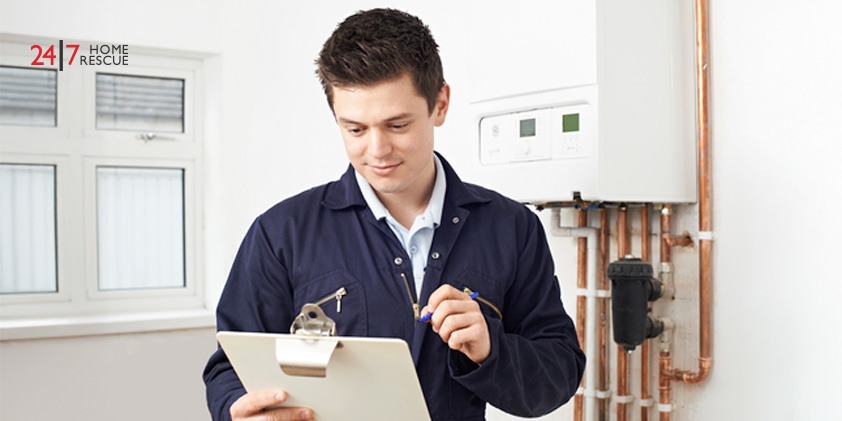 An image showing an engineer performing inspection on a modern gas boiler