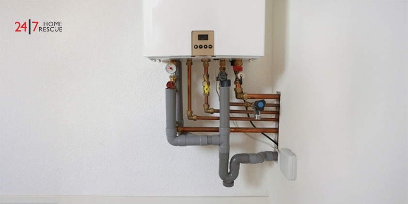 An image showing gas boiler in white wall indoors
