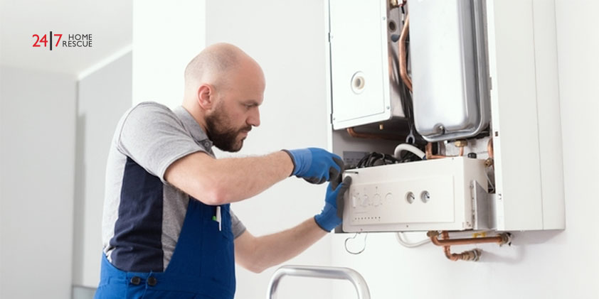 An engineer fixing a boiler