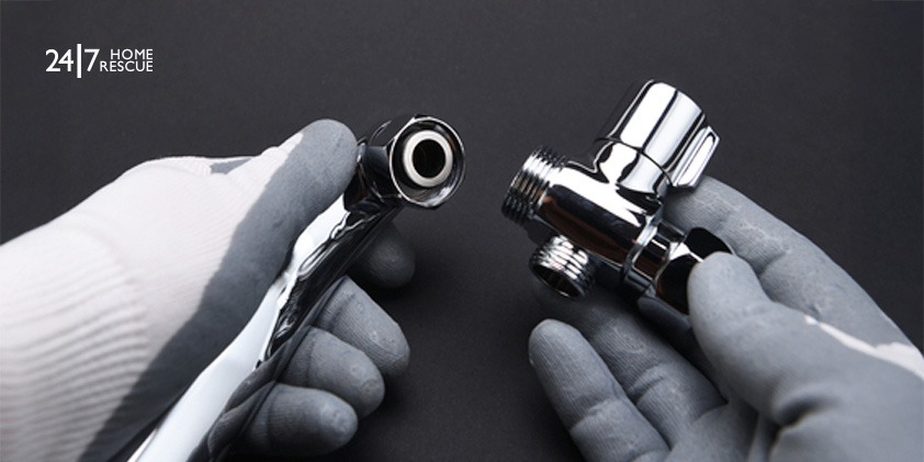 Engineer repairing a boiler’s diverter valve on a black background