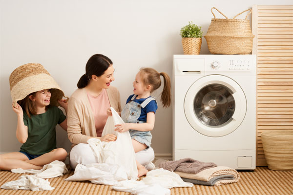 Family members enjoying beside a washer dryer