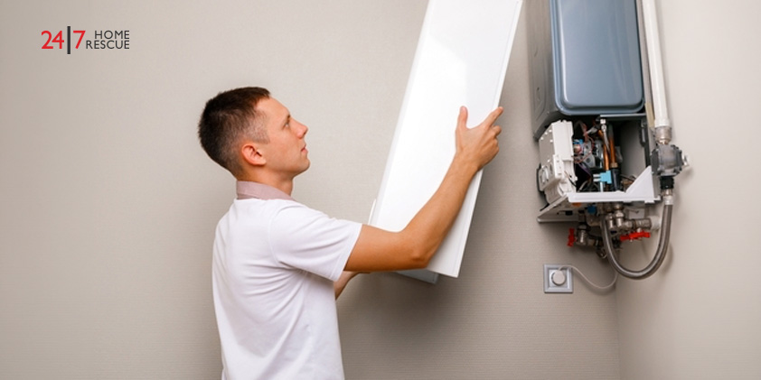 Homeowner opening a boiler cover for inspection before a routine boiler service