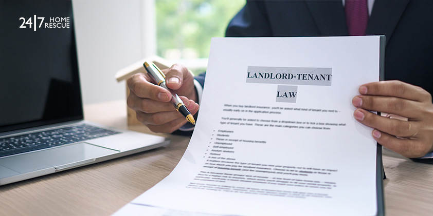 Man-holding-landlord-tenant-law-document